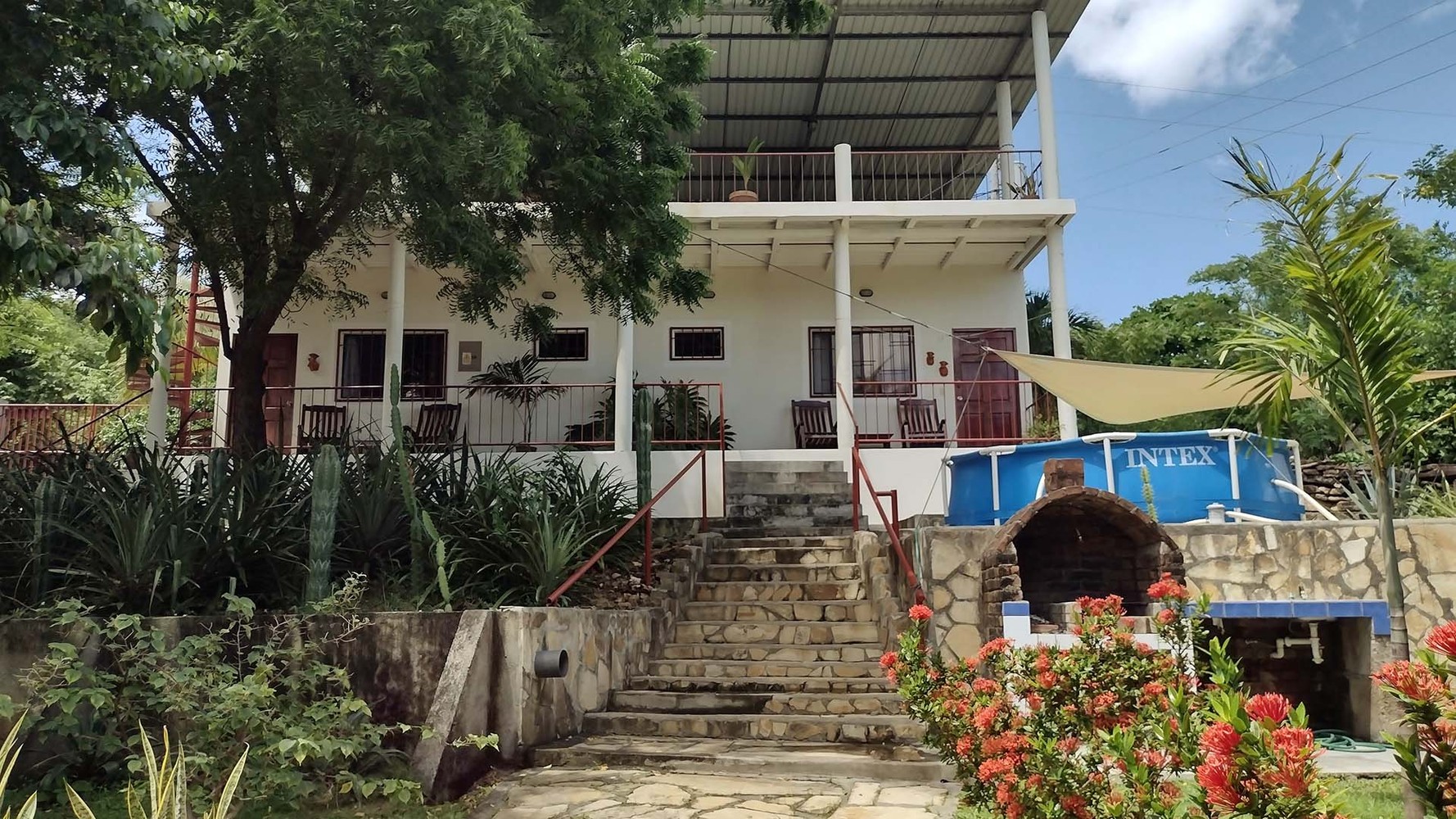 North Casita with queen and twin beds, garden view at Casa Todo Bueno